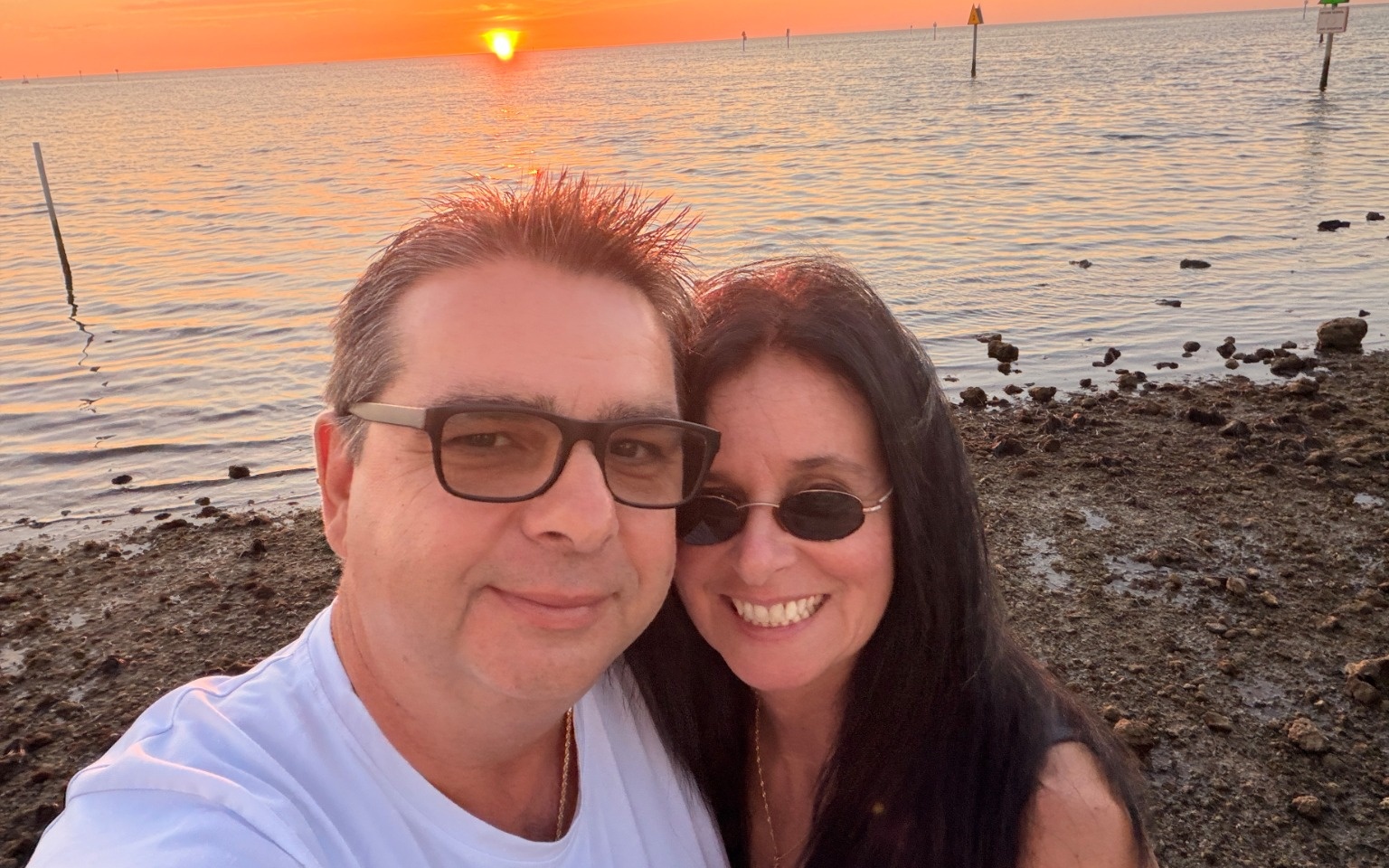 Jimmy and Tanya together at a Florida waterfront sunset